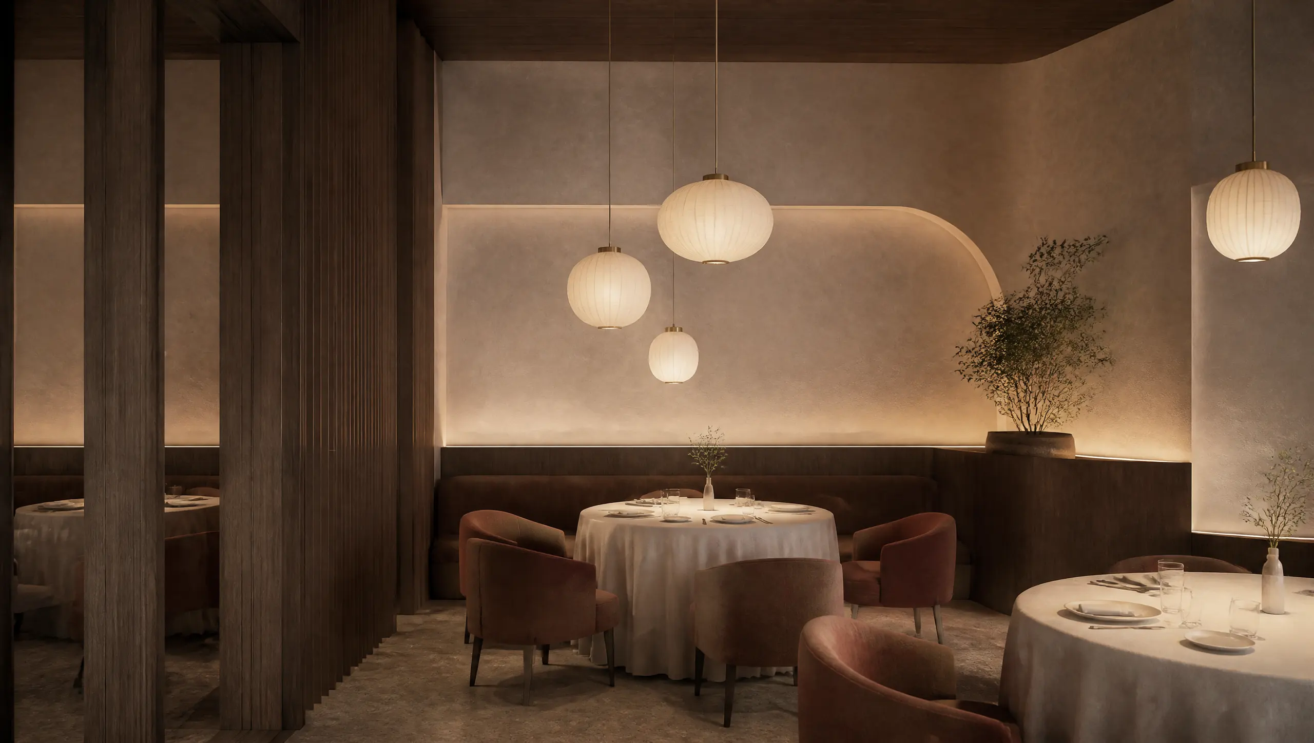 The dining room of a fine-dining restaurant in warm minimalism: smoked-oak panelling, lime-plaster walls, round tables and vertical oak fins