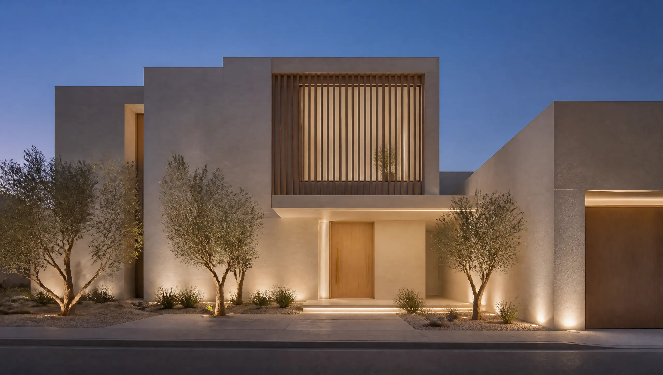 A contemporary Riyadh villa facade at dusk: limestone massing, vertical timber slats and a warm linear light