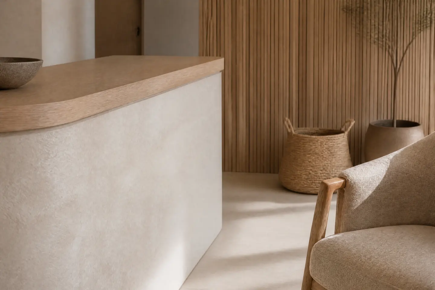 A close-up of the plaster counter edge and its light oak top